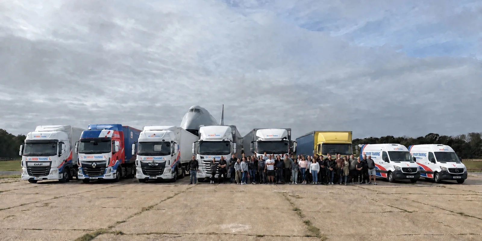 Velocity Transport Planning corporate group with GS Driver Training vehicles after an HGV experience day at Dunsfold