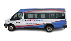 Minibus with "CS Driver Training" branding, representing D1 driver training for safely transporting passengers.